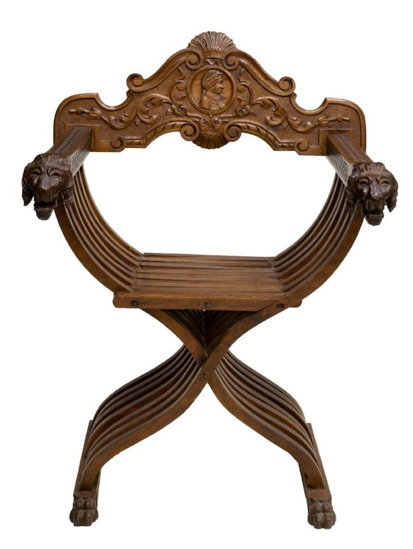 ITALIAN RENAISSANCE REVIVAL LION CARVED CHAIR: Italian Renaissance Revival Savonarola chairs, 19th c., having foliated back rest with central portrait in profile, slatted folding frame ending in lion head hand holds, on front paw feet, approx 37"h
