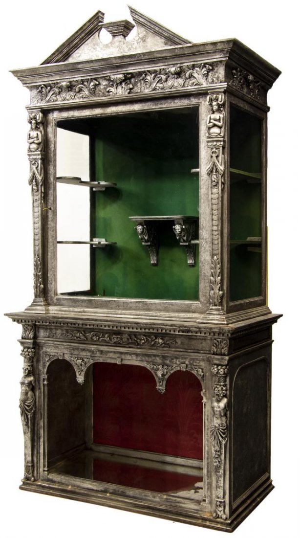 FRENCH RENAISSANCE REVIVAL SILVERED VITRINE: French Renaissance Revival vitrine, 19th c., having an antiqued silvered finish and accented with foliate carving and flanking figural pilasters, the upper cabinet with a split pediment cornice above 