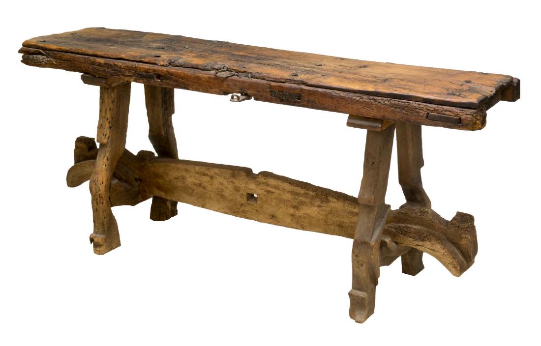 CONSOLE TABLE FASHIONED FROM AN ANTIQUE DOOR: Console table fashioned from an antique door, retaining some original hardware, raised on ox yoke legs joined by an ox yoke stretcher, 31"h, 72"w, 21"d Start Price: $150.00