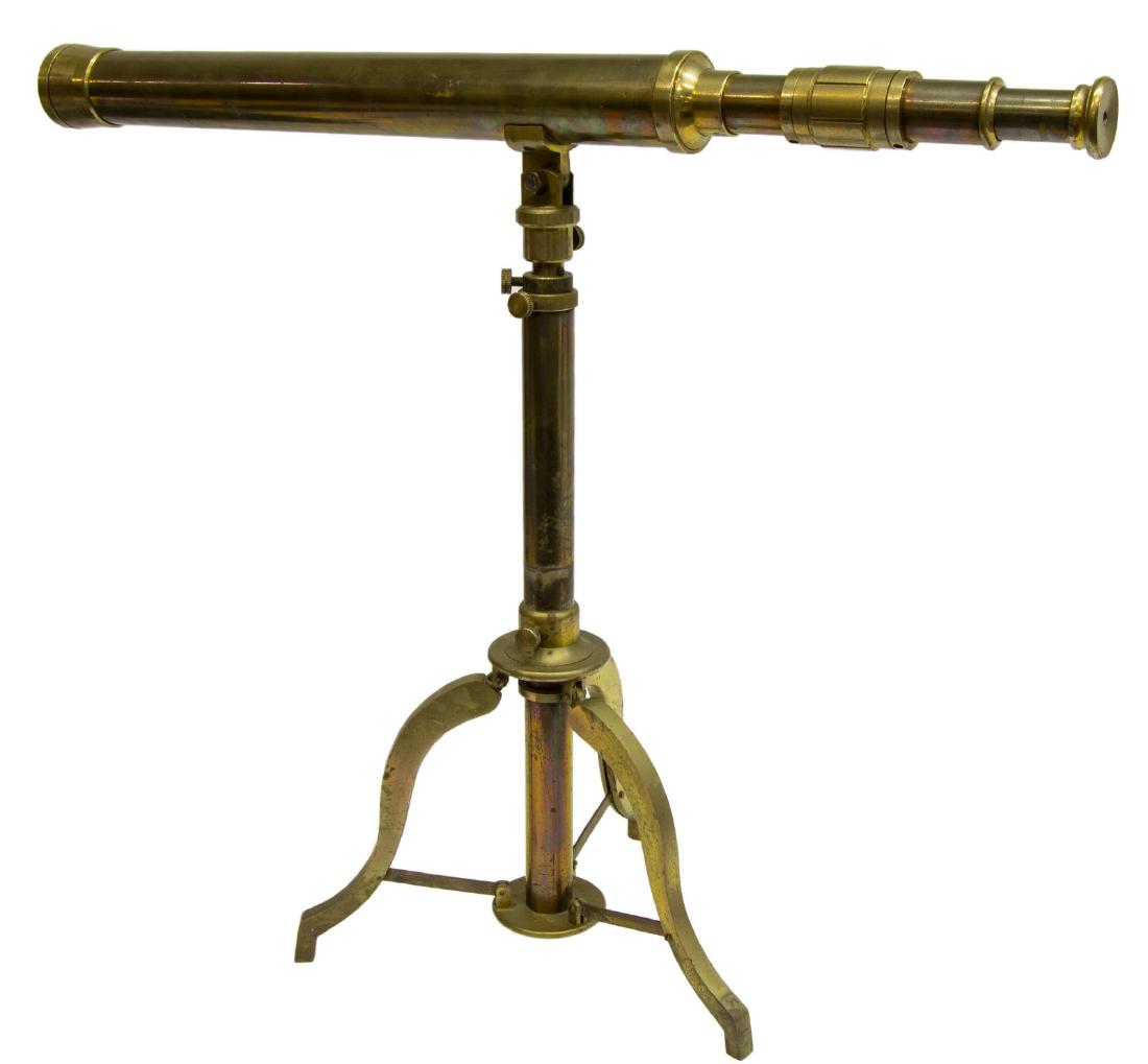 ADJUSTABLE BRASS MARINE TELESCOPE ON TRIPOD BASE: Brass telescope on adjustable tripod base with folding legs, for table top or floor use, retaining lens cover, floor: approx 51.5"h, 29"w, table top: approx 23"h, 10.25lbs Start Price: $150.00