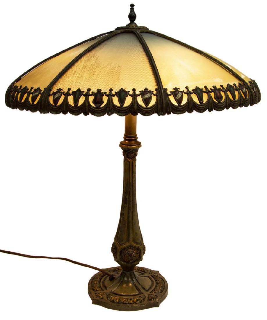 BRADLEY & HUBBARD GLASS SHEILD SWAG TABLE LAMP: American Bradley & Hubbard glass and gilt patinated table lamp, early 20th c., inset textured glass panels painted to the underside, held by a metal swag frame alternating green medallions and red shi