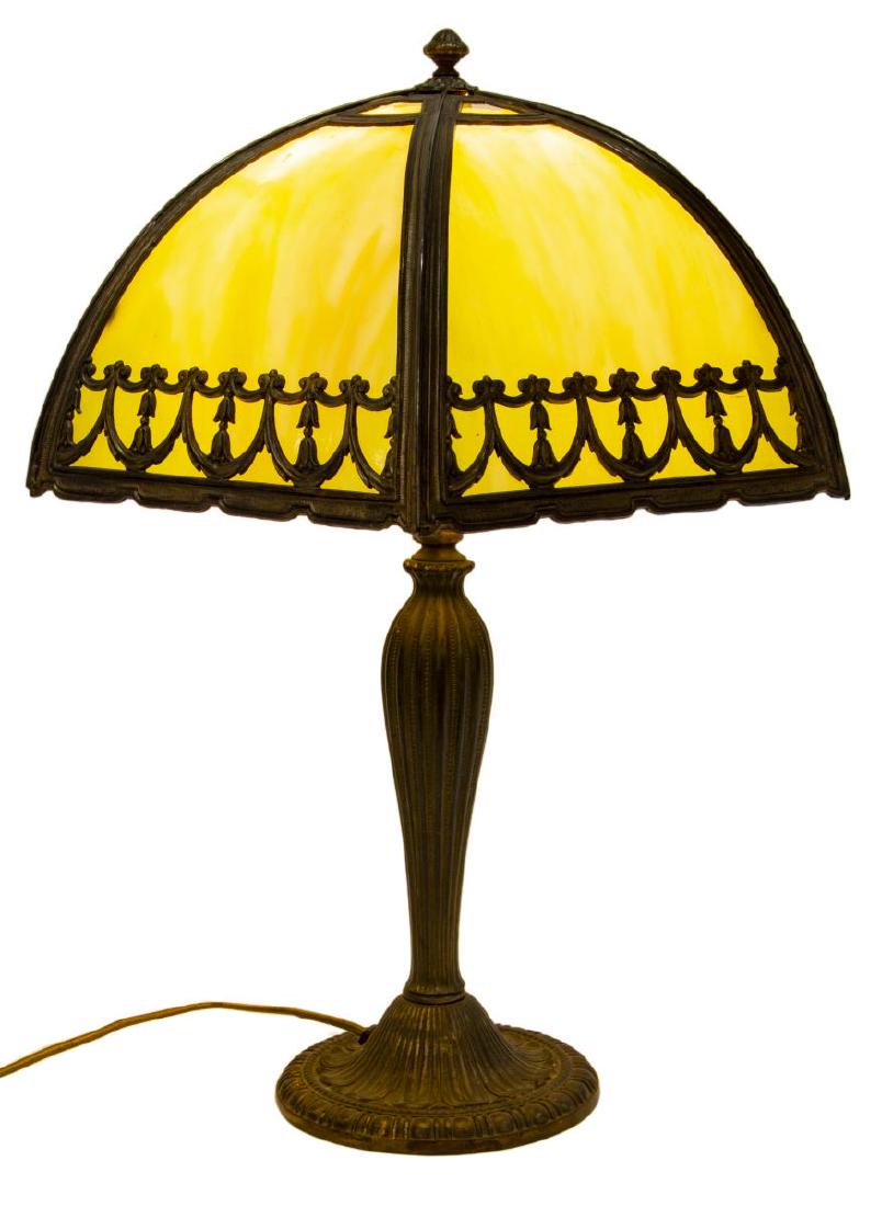 AMERICAN SLAG GLASS & PATINATED METAL TABLE LAMP: American slag glass table lamp, early 20th c., having slag glass shade, with pierced metal overlay, concealing a single light, over patinated metal base, with fluted standard, rising on gadrooned circ