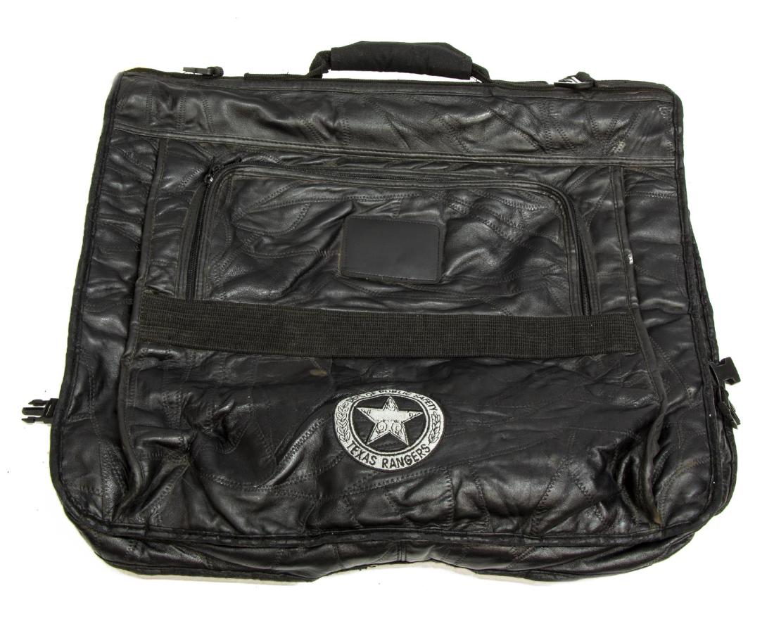 TEXAS RANGER GARMENT BAG: Black garment bag with Texas star and marked Department of Public Safety, Texas Rangers, folded: 20"h, 21"w, 2.5"d, 3.5lbs*Provenance: (1) our consignor; (2) Estate of Grady Claude Sessums, 1937-2017,