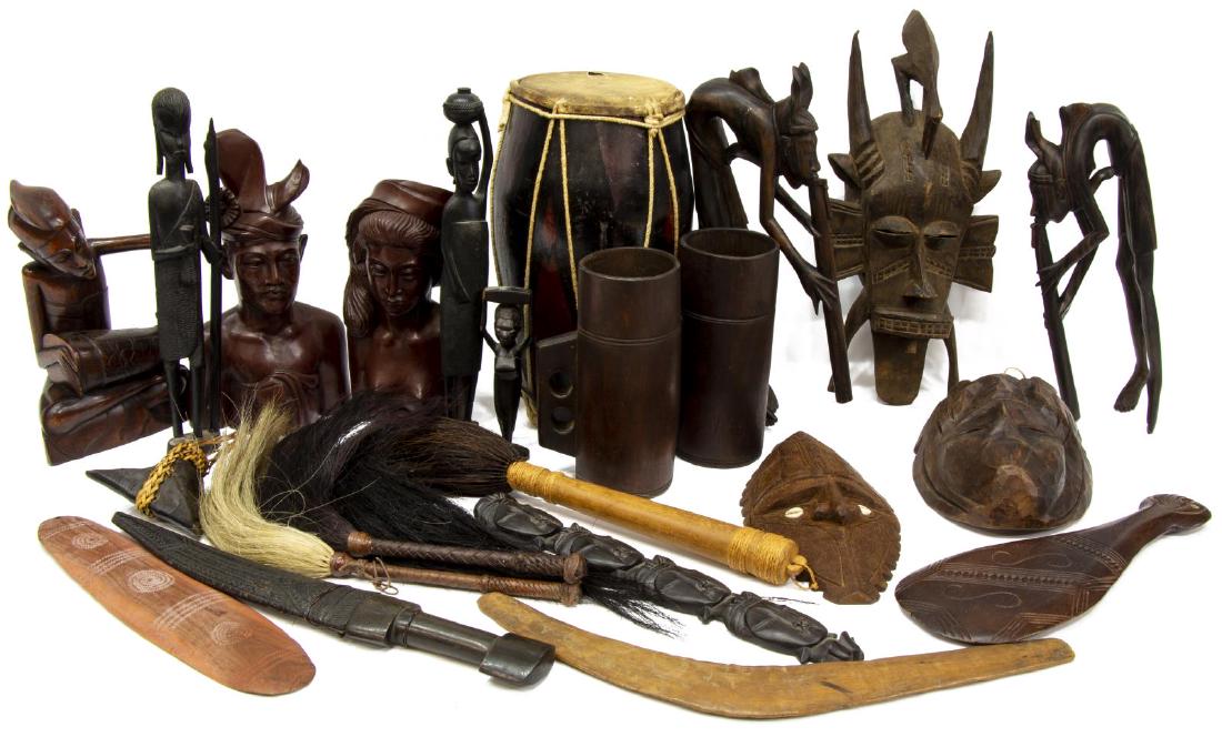 (LOT) LARGE GROUP OF AFRICAN MASKS TRIBAL CARVINGS: (lot) Large collection of African and tribal wood carvings, highlights include: (1) drum, 14"h, 8"diam, (1) mask with cowrie shell eyes, 11.75"h, 5.5"w, (1) carved mask with horns and bird perched on 