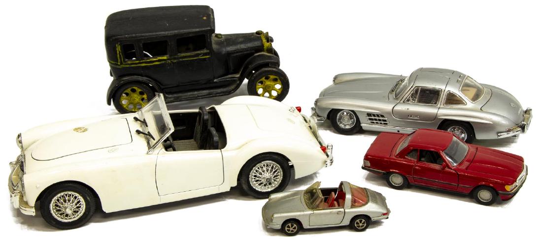 (5) MODEL CARS, ARCADE IRON MODEL A, 54 MERCEDES: (5) Model cars: Arcade Model A Sedan #107, 1920's, cast iron automobile, internal marks include, S3 and S2, lacking driver, overall: 6.5" long; (1) 1954 Mercedes 300SL, Franklin Mint Precision Models,