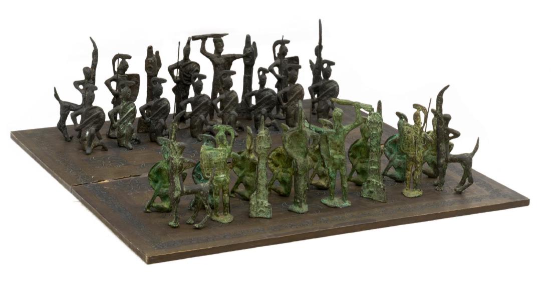 (33) LARGE BRUTALIST PATINATED BRONZE CHESS SET: (lot of 33) Brutalist bronze chess set, c. 1960s-1970s, in the style of Alberto Giacometti (Switzerland, 1901-1966), including: (32 pieces) the figures cast wearing ancient armor, possibly Etruscan or