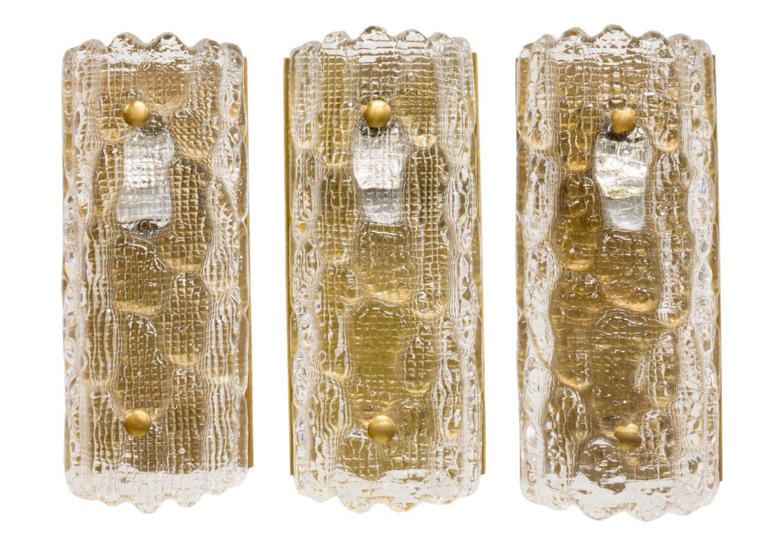 (3) CARL FAGERLUND FOR ORREFORS WALL SCONCES: (lot of 3) Swedish mid-century modern wall sconces, designed by Carl Fagerlund (Sweden, 1915-2011) for Orrefors, having art glass shade, concealing a single light, on gilt metal backing plate, in need