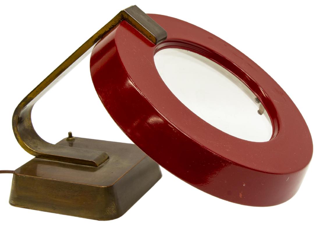 MODERNIST INDUSTRIAL DESK LAMP: Modernist desk lamp, mid 20th c., having red steel circular disc shade, with central glass pane, concealing florescent bulb, on fixed gooseneck support, ending in square base, approx 12"h, 13.25"w, 17