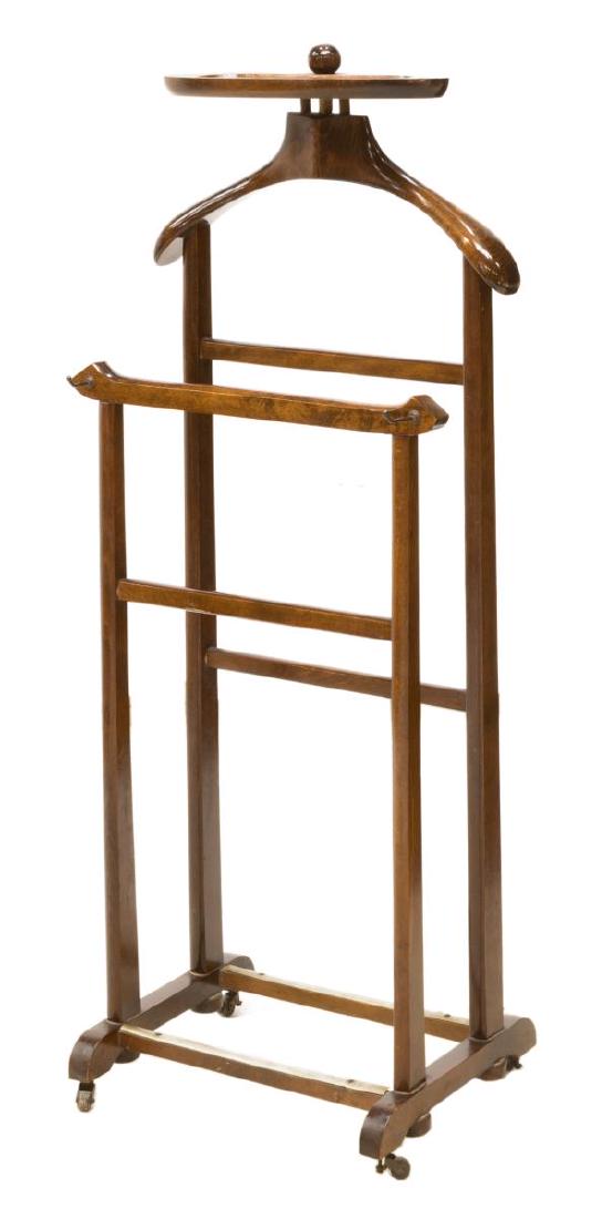 ITALIAN MID-CENTURY MODERN GENTLEMAN'S VALET STAND: Italian mid-century modern gentleman's valet, c. 1960s, with accessories tray, over coat and pants hangers, on casters, approx 44.25"h, 18"w, 13.25"d Start Price: $100.00