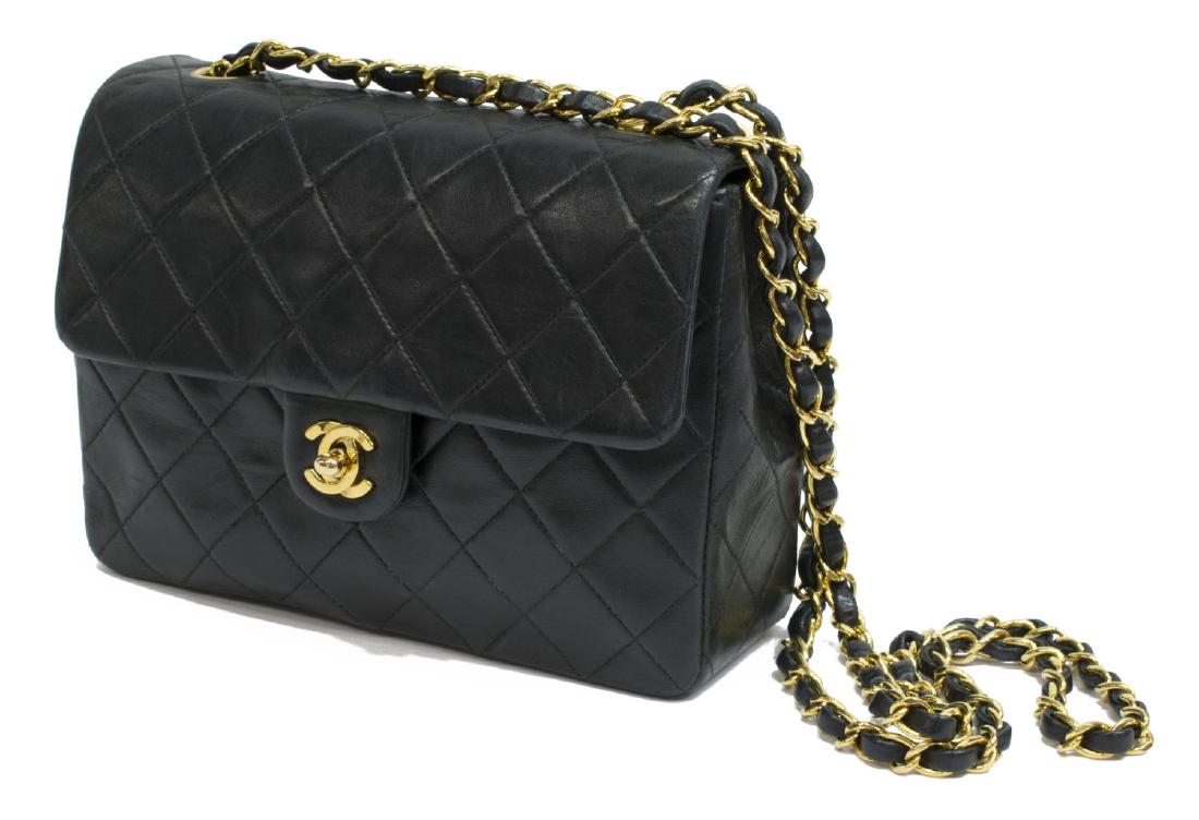 VINTAGE CHANEL 'CLASSIC MINI SQUARE FLAP' BAG: Chanel "Classic Mini Square Flap" bag, in black quilted lambskin leather, with gold-tone hardware, single woven leather chain-link shoulder strap, burgundy leather lining, two slip and one zipper pock