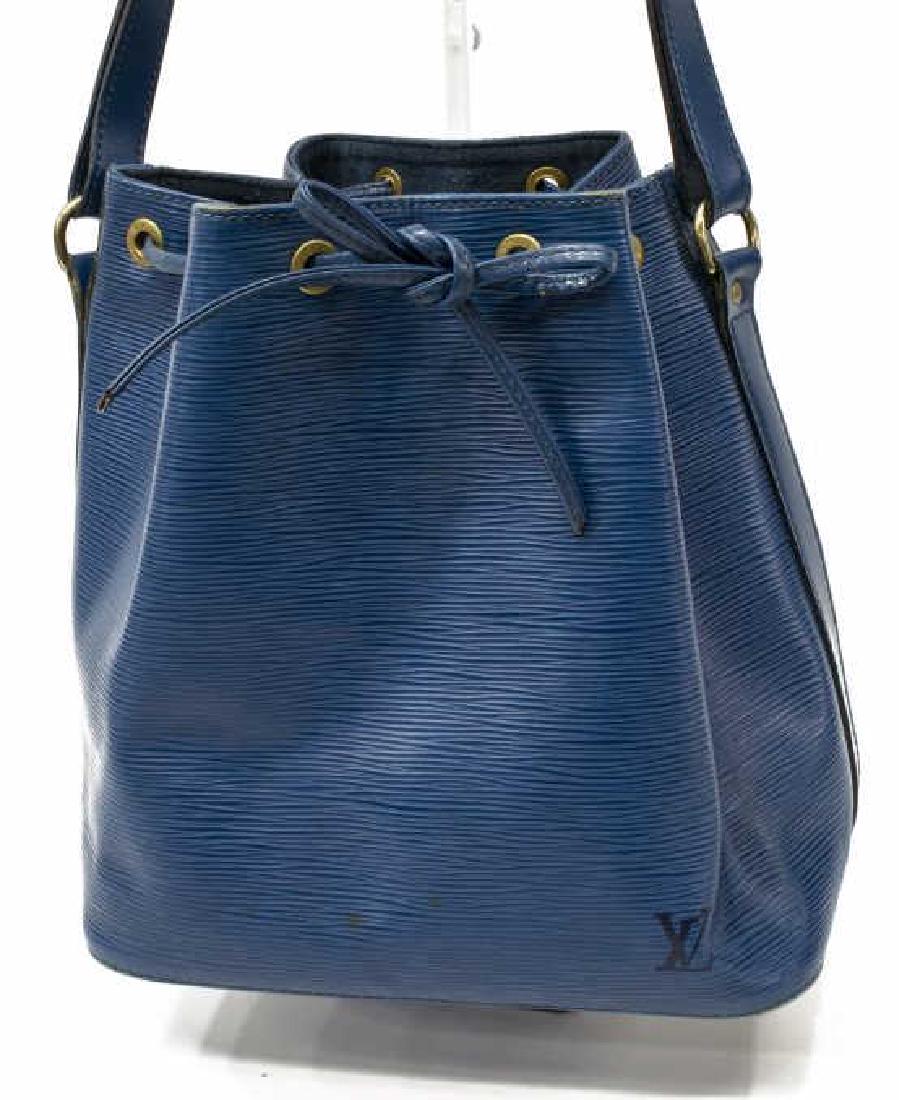 LOUIS VUITTON 'NOE PM' BUCKET BAG BLUE EPI LEATHER: Louis Vuitton â€œNoe PMâ€ bucket bag, in blue Epi leather, with brass hardware, adjustable flat shoulder strap, drawstring closure at front face, exterior and interior spotting, wear to drawstr