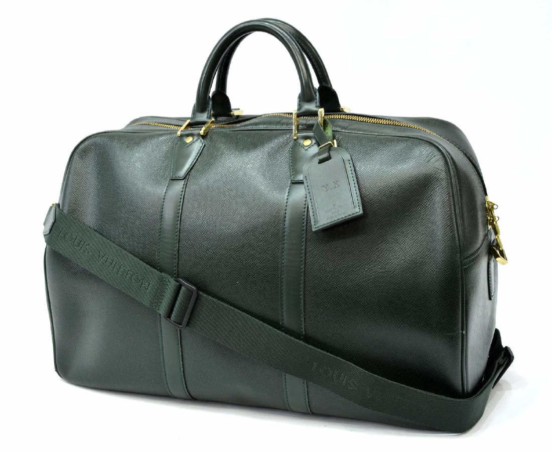 LOUIS VUITTON 'KENDALL PM' GREEN TAIGA LEATHER: Louis Vuitton "Kendall PM", in dark green taiga leather, with brass hardware, dual rolled handles, adjustable shoulder strap, zip closure at top, retaining luggage tag, shoulder strap, some spotting t