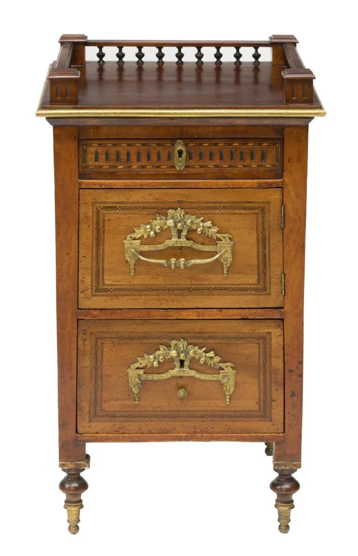 FRENCH SPINDLED & CARVED MAHOGANY NIGHTSTAND: French mahogany nightstand, 19th c., top with spindled gallery, case fitted with two drawers and center cabinet, with contrasting geometric marquetry, over-sized gilt metal hardware, rising on turned 