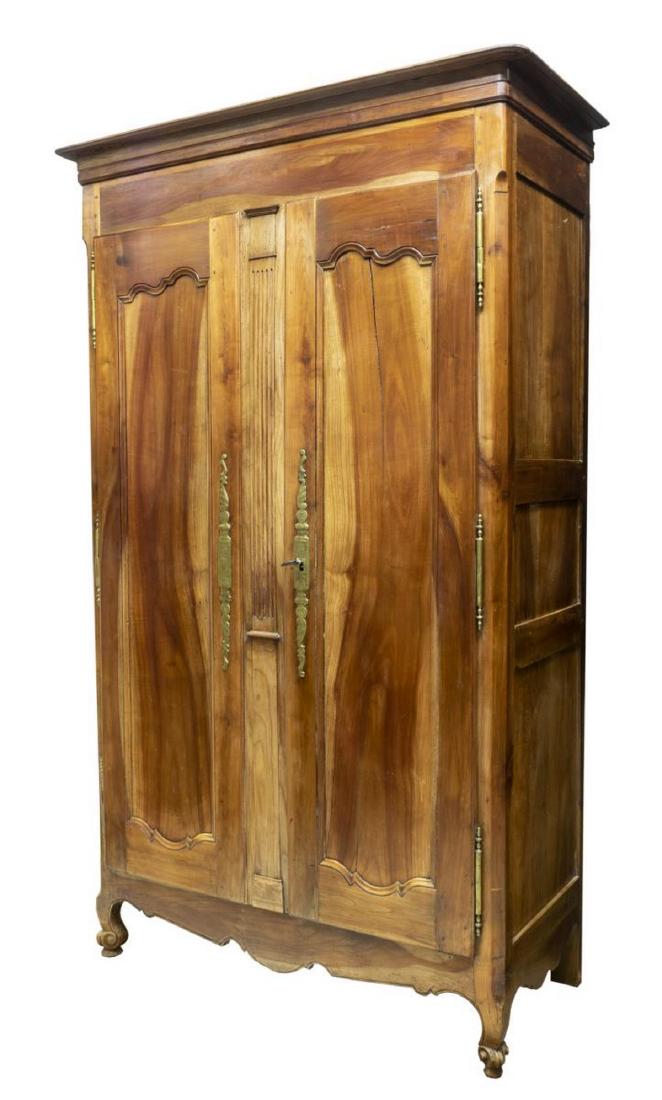 FRENCH LOUIS XV STYLE FRUITWOOD ARMOIRE: French Louis XV style fruitwood armoire, 19th c., having cornice top, over paneled double doors centered by a fluted pilaster, with exterior hinges, interior fitted with hanging rod, scrolled apron, r