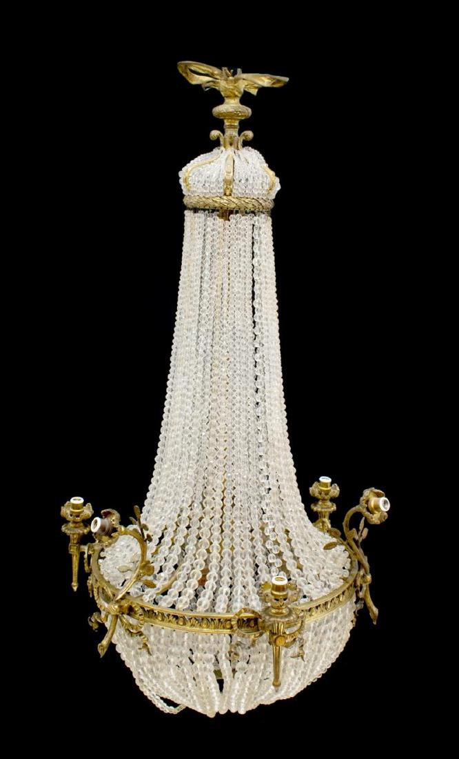 MARIA THERESA CRYSTAL 8-LIGHT CHANDELIER: Italian Maria Theresa crystal eight-light chandelier, 20th c., having eight lights within candle covers, each on individual arm, surrounding a crystal standard, in need of wiring, approx 25.25"h, 20"d