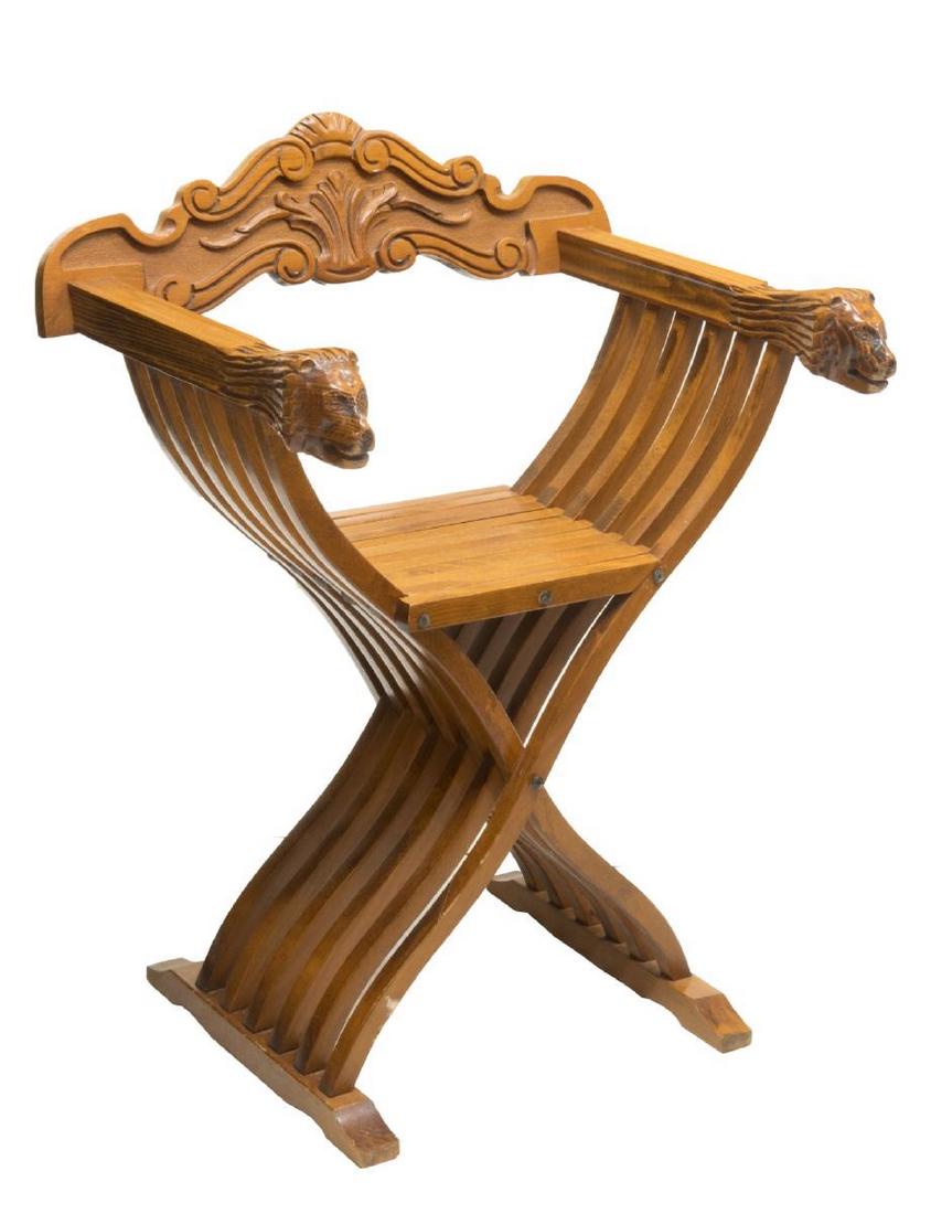 FRENCH SAVONAROLA CHAIR: French savonarola chair, 20th c., having carved back rest, with slatted folding frame ending in lion head hand holds, approx 32.75"h, 25.75"w, 20.25"d Start Price: $100.00