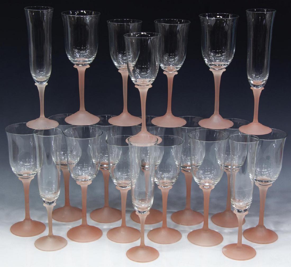 (21) COLLECTION OF FROSTED PINK GLASS STEMWARE: (lot of 21) Glass stemware, with colorless bowls, on frosted pink stems, comprising: (11) red wine stems, 8.5"h, (5) white wine stems, 8"h, (5) champagne flutes, (one) with fleabites to rim, 9"h; 6.5l