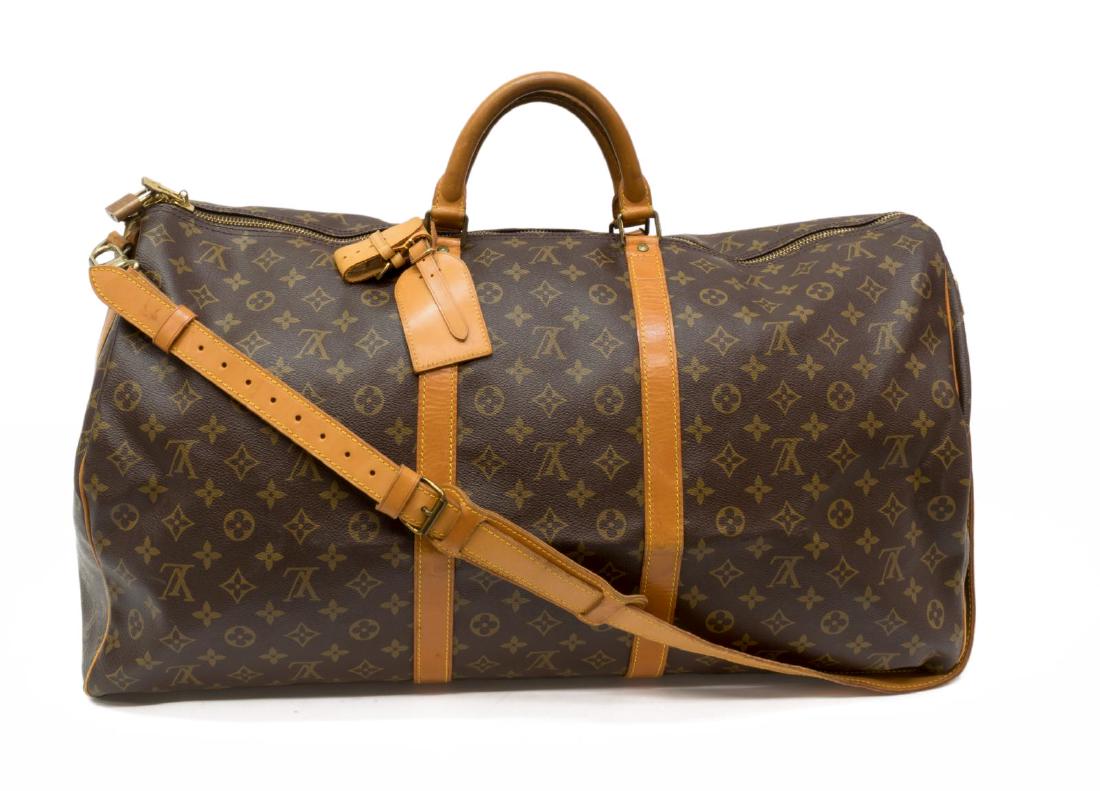 LOUIS VUITTON KEEPALL BANDOULIERE MONOGRAM DUFFLE: Louis Vuitton "Keepall 60 Bandouliereâ€ duffle bag, in brown and tan monogram coated canvas, with brass hardware, tan vachetta leather trim, detachable flat shoulder strap, dual rolled handles, bro