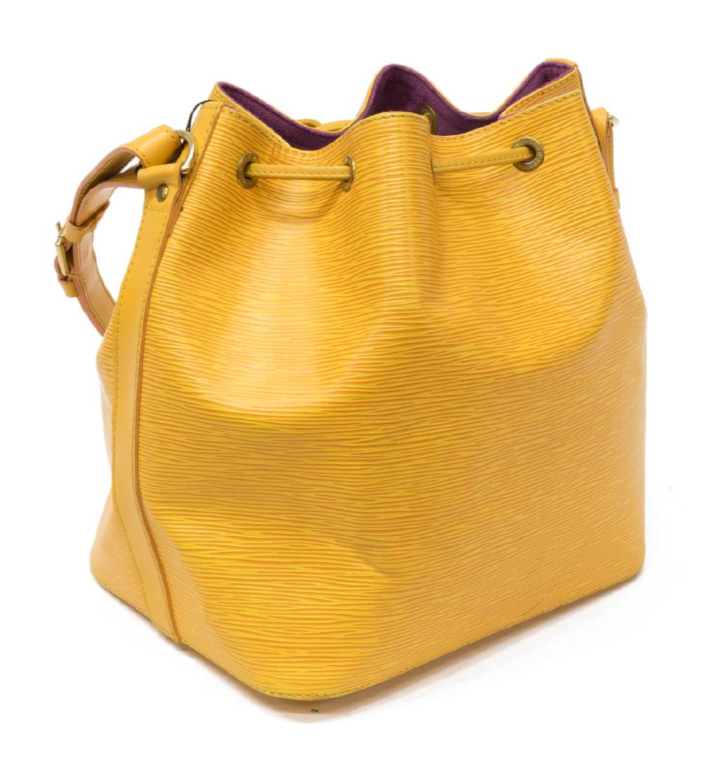 LOUIS VUITTON 'NOE PM' YELLOW EPI BUCKET BAG: Louis Vuitton "Noe PM" bucket bag, in yellow Epi leather, with brass hardware, adjustable flat shoulder strap, drawstring closure at front face opening to violet Alcantara lined interior, creasing, sp