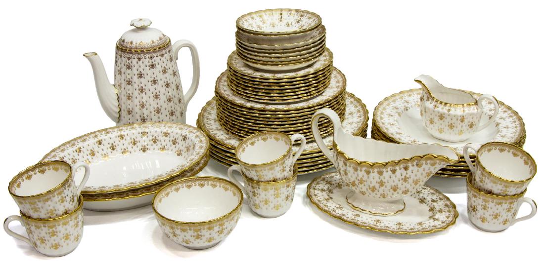 (52) SPODE FLEUR DE LYS GILT BONE CHINA DINNER SET: (lot of 52) Spode bone china dinner service in the "Fleur de Lys Gold" pattern, scallop edge with gilt rim and floral border, comprising: (6) dinner plates, 10.75" diam; (11) salad plates, 11"diam; (8