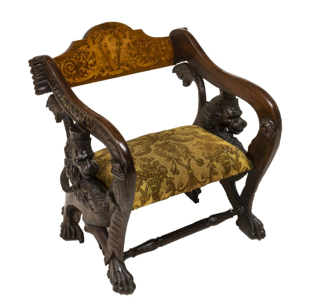 ITALIAN WALNUT GONDOLA-FORM MEDICI ARMCHAIR: Italian walnut gondola-form armchair, 19th c., shaped back with contrasting marquetry of winged caryatids centering the Medici coat of arms, worn damask patterned seat, sides well carved with crowned 