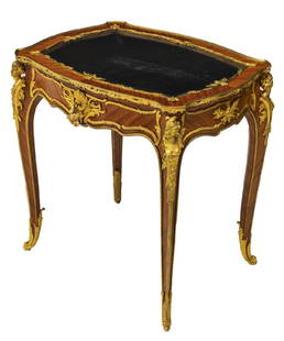 FRANCOIS LINKE (FRENCH) DORE BRONZE VITRINE TABLE: Spectacular Louis XV style ormolu-mounted kingwood vitrine table, c. 1900, signed F. Linke (Francois Linke, France, 1855-1946), the structure having brightly gilded dore trim throughout in shell and f