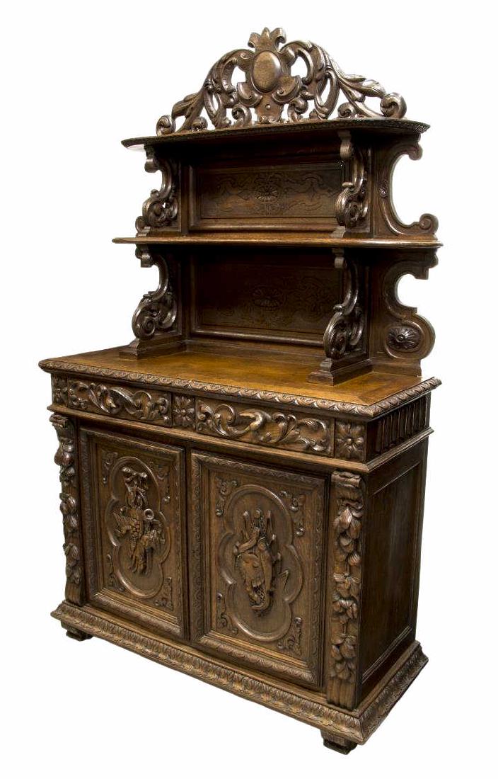 FRENCH RENSASSANCE REVIVAL HUNT BOARD: French Renaissance Revival oak hunt board, c. 1880, having an arched pierced cornice over shelves framed by scrolled supports, a work surface above two frieze drawers with eagle pulls and two lower do