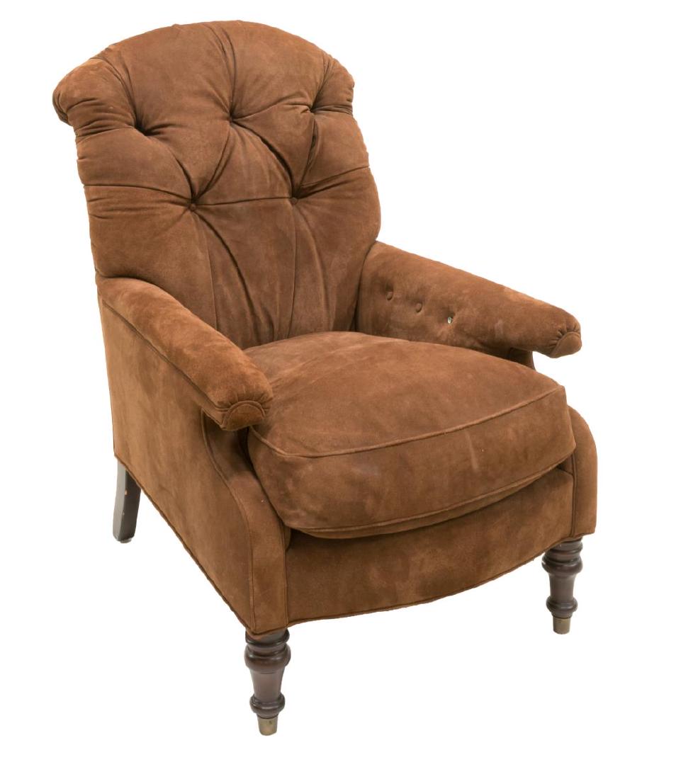 TUFTED BROWN SUEDE UPHOLSTERED ARMCHAIR: Armchair, 20th c., in brown suede upholstery, with rolled button-tufted back, removable seat cushion, rising on turned legs, lacking one button on right arm, approx 41"h, 28"w, 33"d Start Price: $80.0