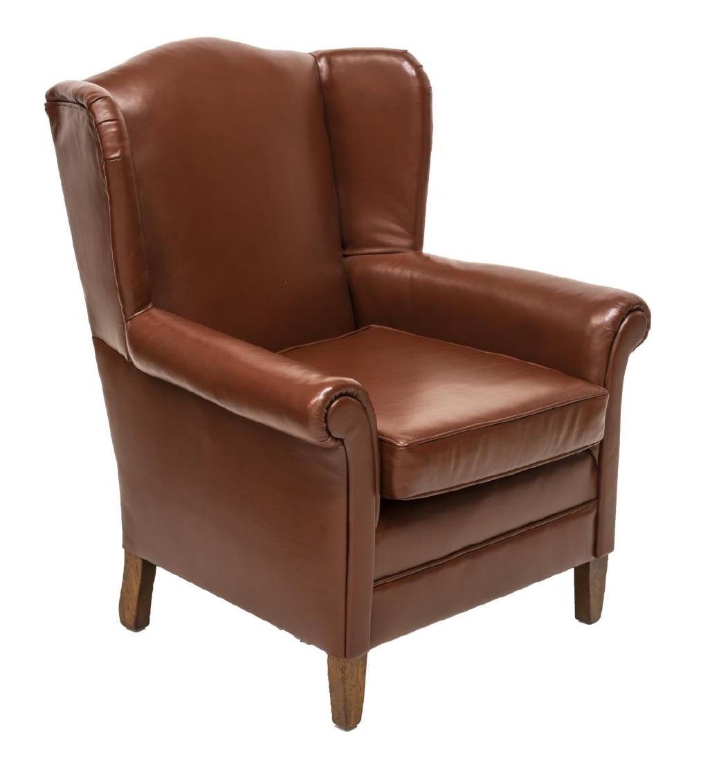BROWN LEATHER WINGBACK ARM CHAIR ON WOOD LEGS: Brown leather wingback arm chair with fixed legs, and removable cushion, approx 38"h, 31"w, 24"d Start Price: $150.00