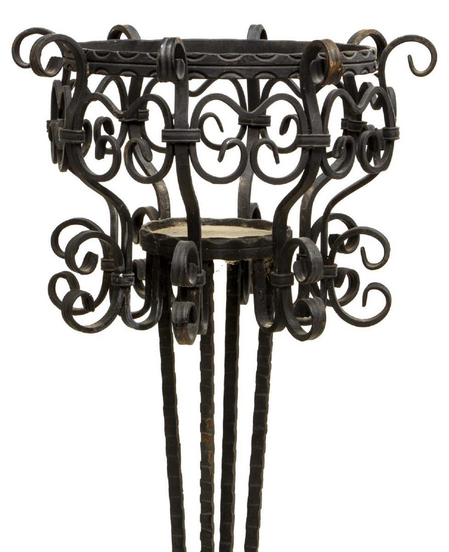 ITALIAN ART NOUVEAU WROUGHT IRON STAND, COPPEDE: Italian Art Nouveau wrought iron stand, early 20th c., in the style of Luigi "Gino" Coppede (Italy, 1866-1927), having scrolled openwork basket, on tapering standard, square base with four upturned sc