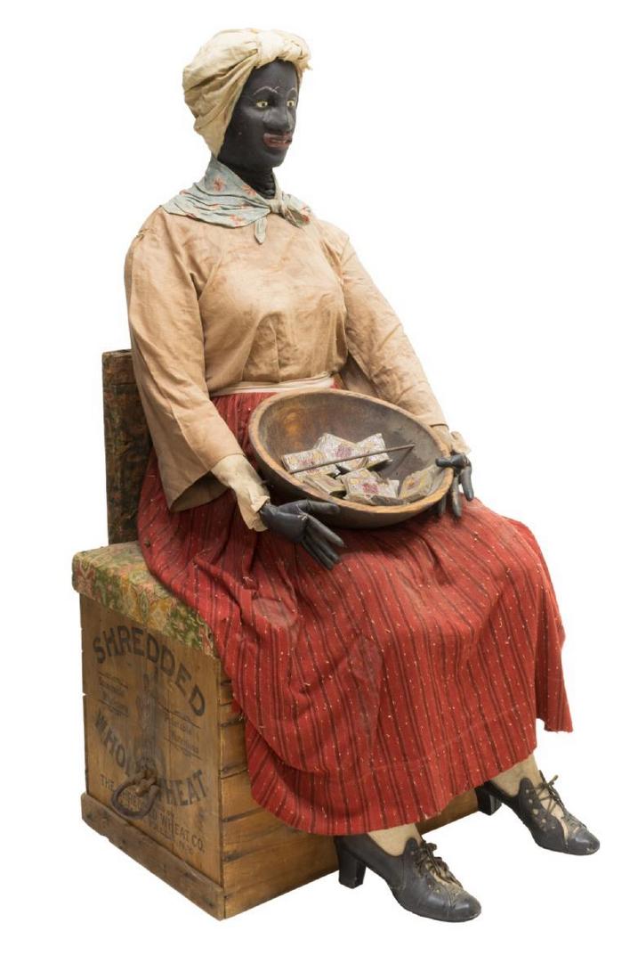 LIFE SIZE BLACK AMERICANA TOBACCO SHOP DISPLAY: Black Americana advertising shop display, early 20th c., dressed life size figure, posed holding a bowl in her lap with Days O Work tobacco, seated on bench fashioned from packing crate branded for Th