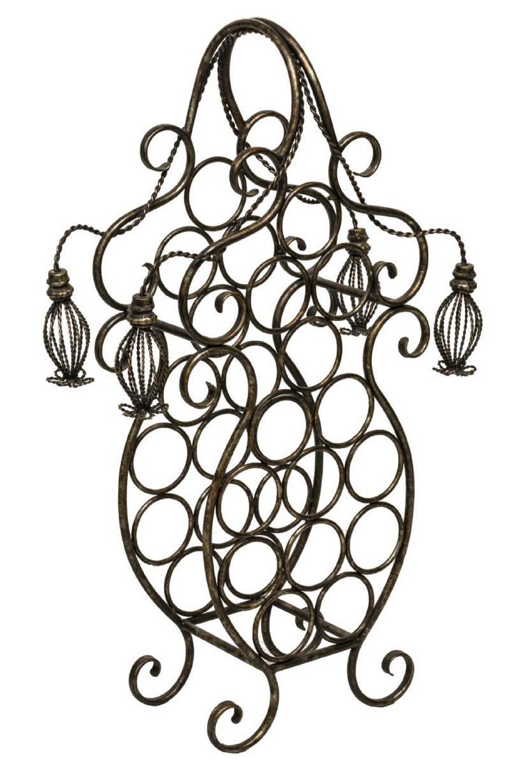 DECORATIVE METAL WINE RACK: Decorative metal wine rack, 20thc., scrolling design with four hanging open work accents, rising on four legs, approx 40"h, 22"w, 10"d Start Price: $60.00