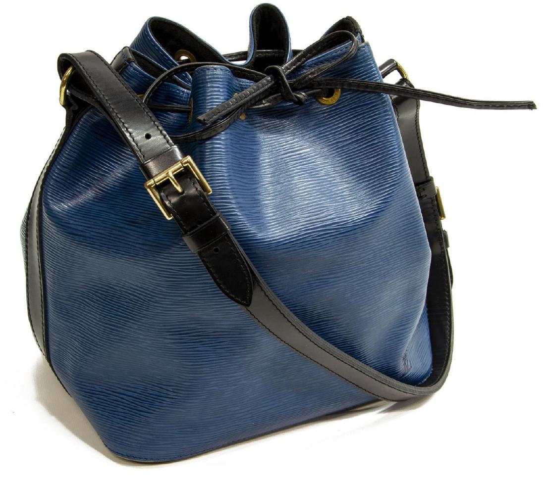 LOUIS VUITTON 'NOE PM' BLUE EPI LEATHER BUCKET BAG: Louis Vuitton "Noe PM" bucket bag, in blue Epi leather with black shoulder strap and stitching, brass hardware, adjustable flat shoulder strap, drawstring closure at front, wear to the leather, measur