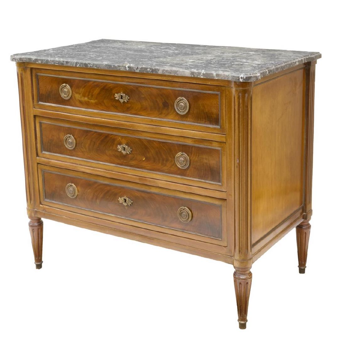 LOUIS XVI STYLE MARBLE TOP MAHOGANY COMMODE: Louis XVI style commode with fitted marble top, 19thc., fluted uprights flanking three drawers, ending in tapered legs, approx 32"h, 28"w, 21"d Start Price: $350.00