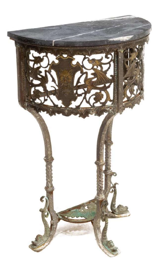 ANTIQUE BRONZE & MARBLE CONSOLE TABLE, GRIFFINS: Antique Continental demilune table, 19th c., a marble top over the bronze pierced panel frieze depicting mask and griffins, supported on iron legs having bronze faced dolphin feet, the legs joined by 