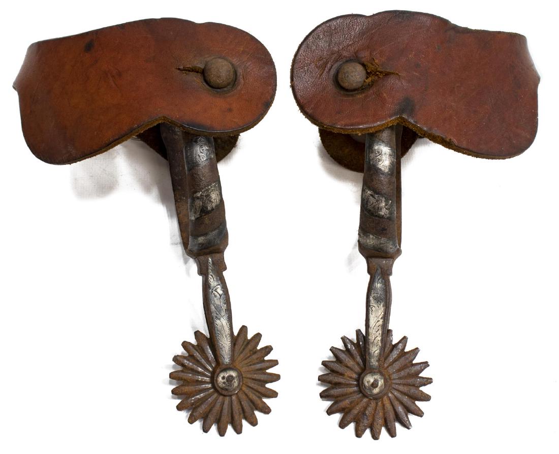 AUGUST BUERMANN UNMARKED SILVER INLAID SPURS: August Buermann unmarked spurs, silver inlaid spurs, 2" rowels, leather straps, 3.25"wide, 3"d Start Price: $250.00