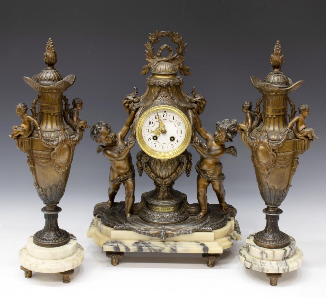3)FRENCH LOUIS XVI STYLE PUTTI GARNITURE CLOCK SET: (3 piece) French cast-metal mantel set, late 19th c., including: (1) clock, with laurel wreath crest, urn-form case, flanked by winged putti, housing enameled fancy dial, time and strike movement mark