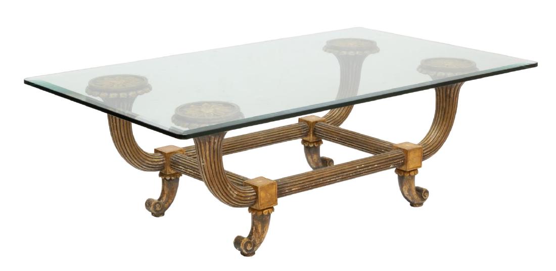 FRENCH GLASS-TOP GILTWOOD COFFEE TABLE: French coffee table, 20th c., having rectangular beveled glass top, over giltwood base, with fluted supports and floral roundels, rising on scrolled legs, approx 18"h, 55"w, 33.5"d Start Price: $100.0