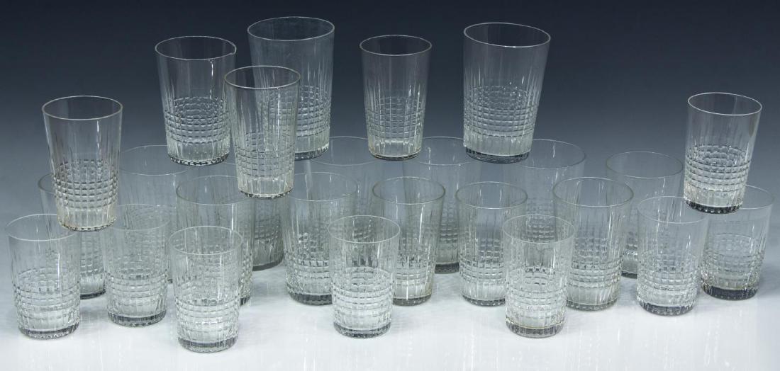(26) BACCARAT 'NANCY' CRYSTAL BARWARE TUMBLERS: (lot of 26) French Baccarat "Nancy" crystal barware, including: (7) tumblers, 3 7/8"h, (5) tumblers, (one) with rim chip, 3 5/8"h, (6) tumblers, unmarked, 3 3/8"h, (8) tumblers, 3 1/8"h; slight variat