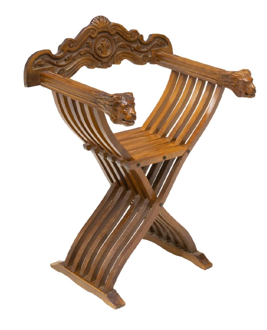 VINTAGE ITALIAN CARVED SAVONAROLA CHAIR: Vintage Italian Savonarola chair, early 20th c., backrest carved with foliate, shell and scrollwork elements, the slatted folding frame ending in lion head hand holds, approx 34"h, 26.25"w, 18.25"d St