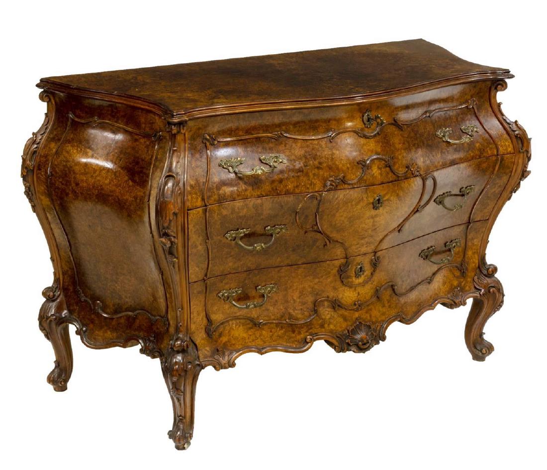 ITALIAN BURLWOOD ROCAILLE & SHELL CARVED COMMODE: Italian burlwood bombe commode, 20thc., applied scrolling and rocaille trim, the case fitted with three drawers, on cabriole legs, ending in scrolled toe, some trim loss to front, approx 30.75"h, 45.7