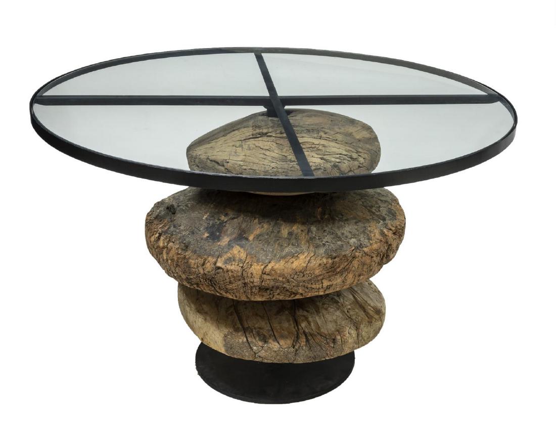 NEW DUPUIS FURN. 'TOCHO' IRON & WOOD DINING TABLE: New Dupuis Furniture "Tocho" dining table, the round table having a glass top, with iron standard encased in three freeform circular wood disks, approx 31.25"h, 47.25"diam *Provenance: Inventory liqui