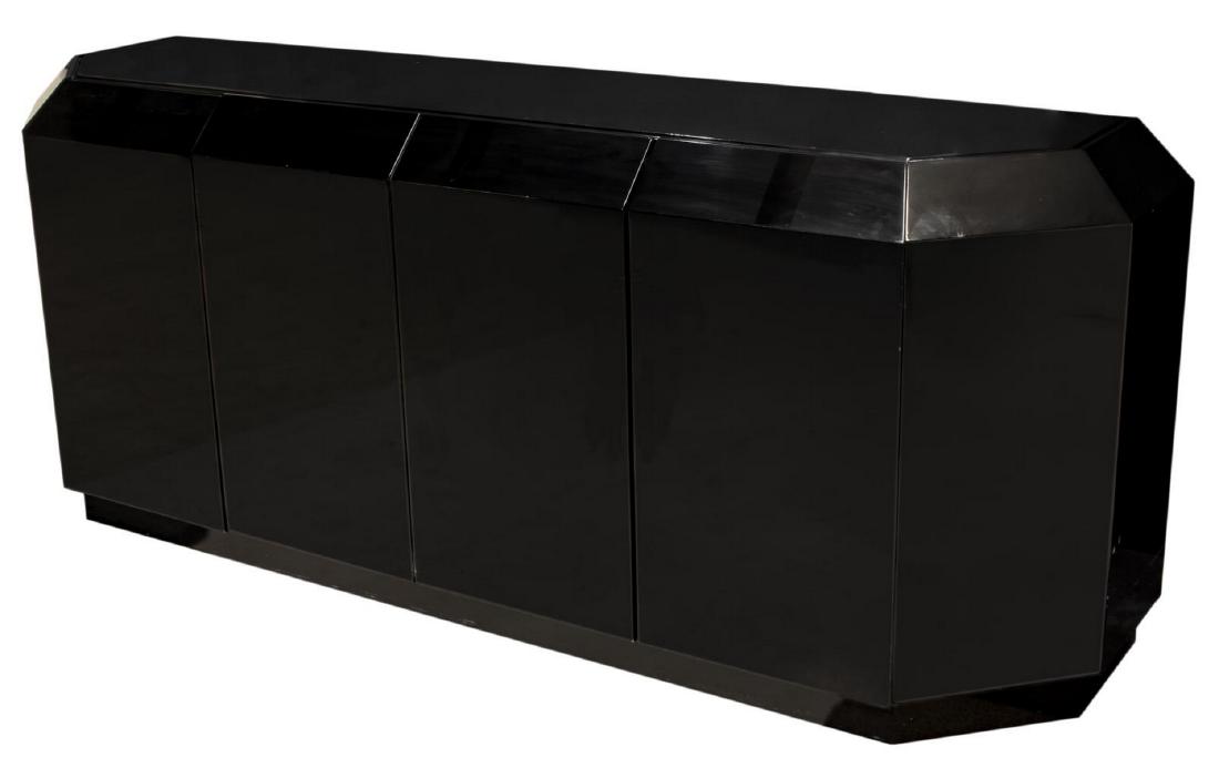 MODERNIST GLOSS BLACK LACQUER SIDEBOARD: Modernist black lacquer sideboard, c. 1970s, canted case, fitted with dual double-door cabinets, left side opening to shelf, right side with small interior drawer and shelf, rising on plinth base, sur
