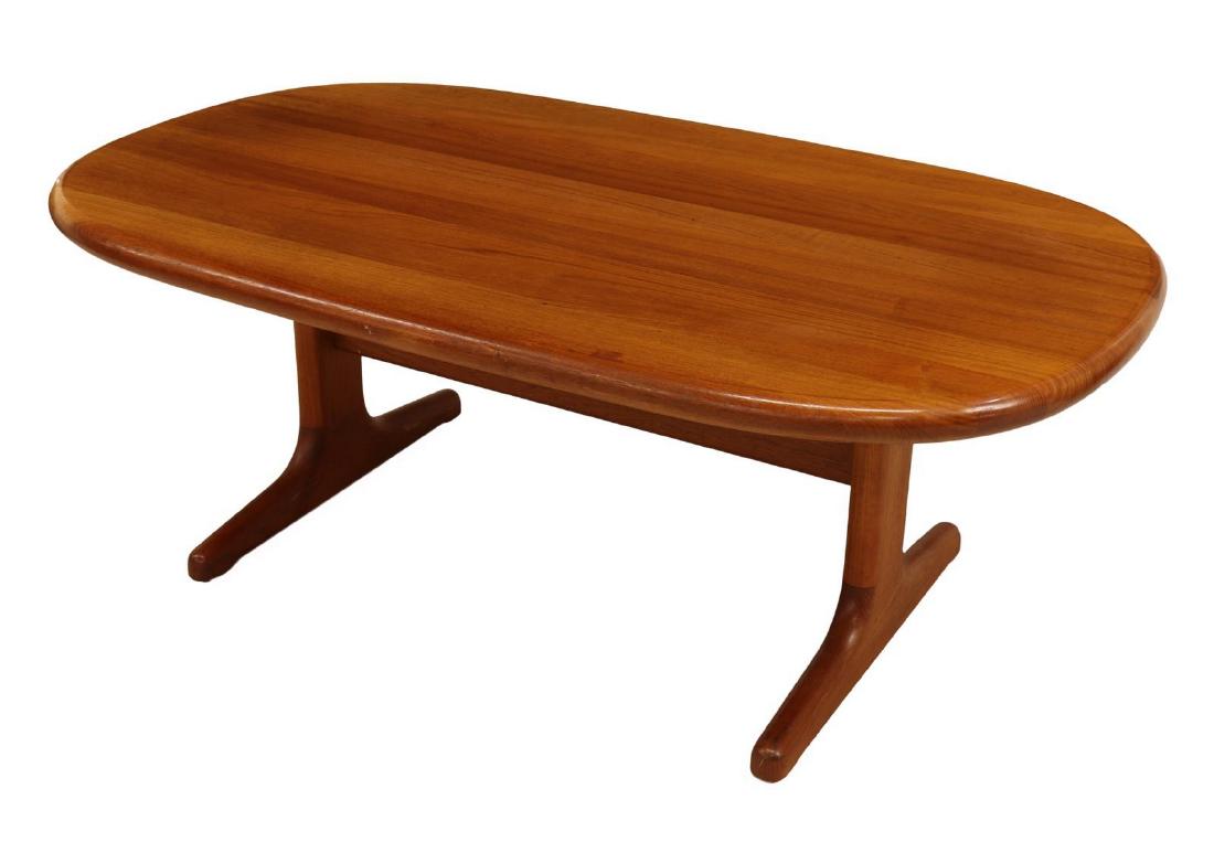 DANISH MID-CENTURY GLOSTRUP TEAK COFFEE TABLE: Danish mid-century modern teak coffee table, c. 1950s, by Glostrup Mobelfabrik, having thick oval top, rising on stretcher-joined trestle base, retains label at underside of tabletop, approx 20"h, 53"
