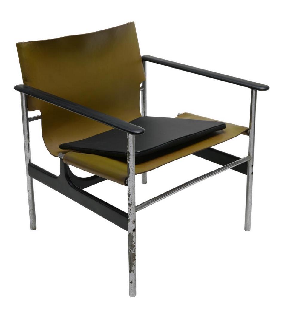 POLLOCK KNOLL ASSOCIATES MODEL 657 SLING ARMCHAIR: Model 657 armchair, designed by Charles Pollock (United States, 1930-2013) for Knoll Associates, tubular chrome steel frame, cast aluminum arms and stretcher in black finish, saddle leather sling seat