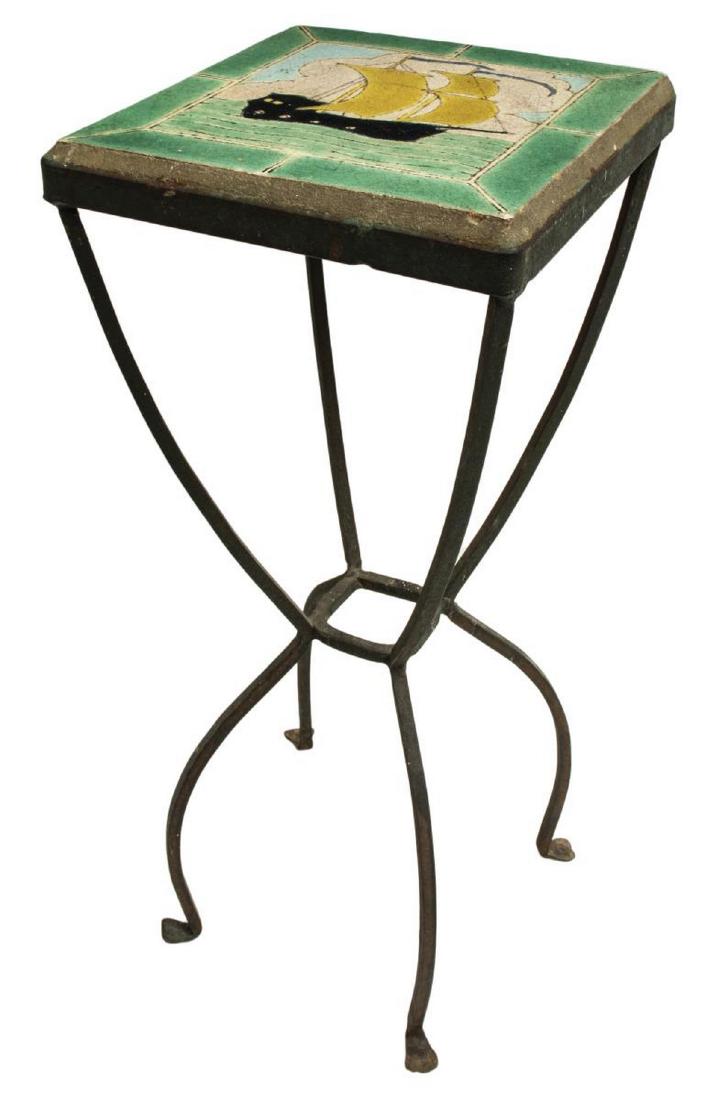 D&M CALIFORNIA (ATTRIB.) TILE-TOP IRON SIDE TABLE: Tile-top side table, c.1930s, having single polychrome tile to tabletop, with ship motif at center, attributed to Davies and McDonald Tile Company (D&M Tiles), rising on four curved iron legs, some cr