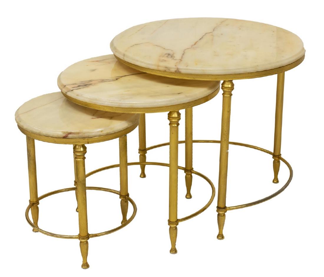 FRENCH MARBLE-TOP GILT METAL NEST OF THREE TABLES: French gilt metal nest of three tables, 20thc., each having circular marble top, on frame with fluted legs, joined by curved stretchers, largest: approx 17.25"h, 19.5"diam Start Price: $150.00