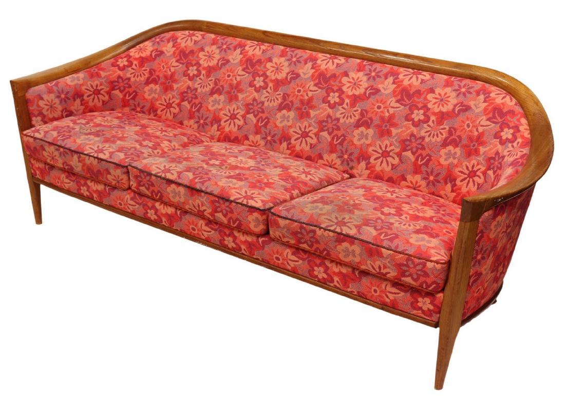DANISH MODERN EXPOSED TEAK FRAME UPHOLSTERED SOFA: Danish modern upholstered teak sofa, c. 1940s-1950s, having exposed teak frame, with polychrome floral upholstery, three removable cushions, rising on tapered legs, discoloration and fading to upholst