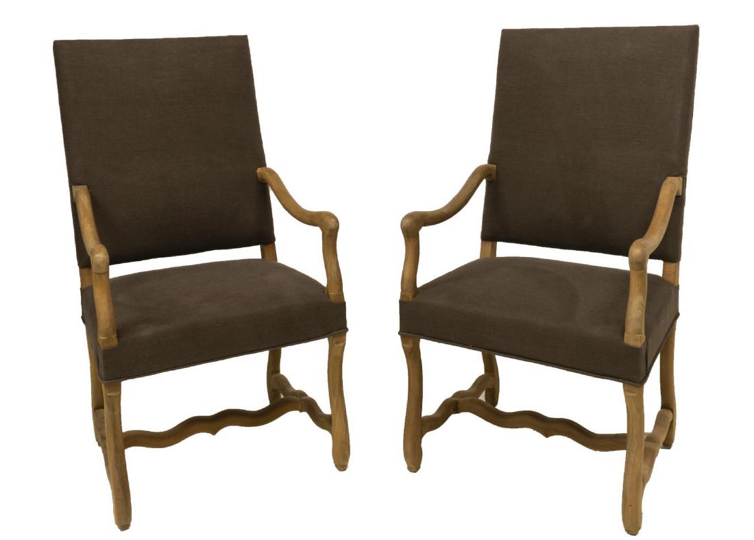 (2) NEW DUPUIS FURNITURE 'PLENTY' ARMCHAIR: (lot of 2) New Dupuis Furniture "Plenty" armchair, having a stained wood frame, with grey upholstery and curved open armrests, rising on four shaped stretcher joined legs, approx 46.25"h, 24.75"w, 24"