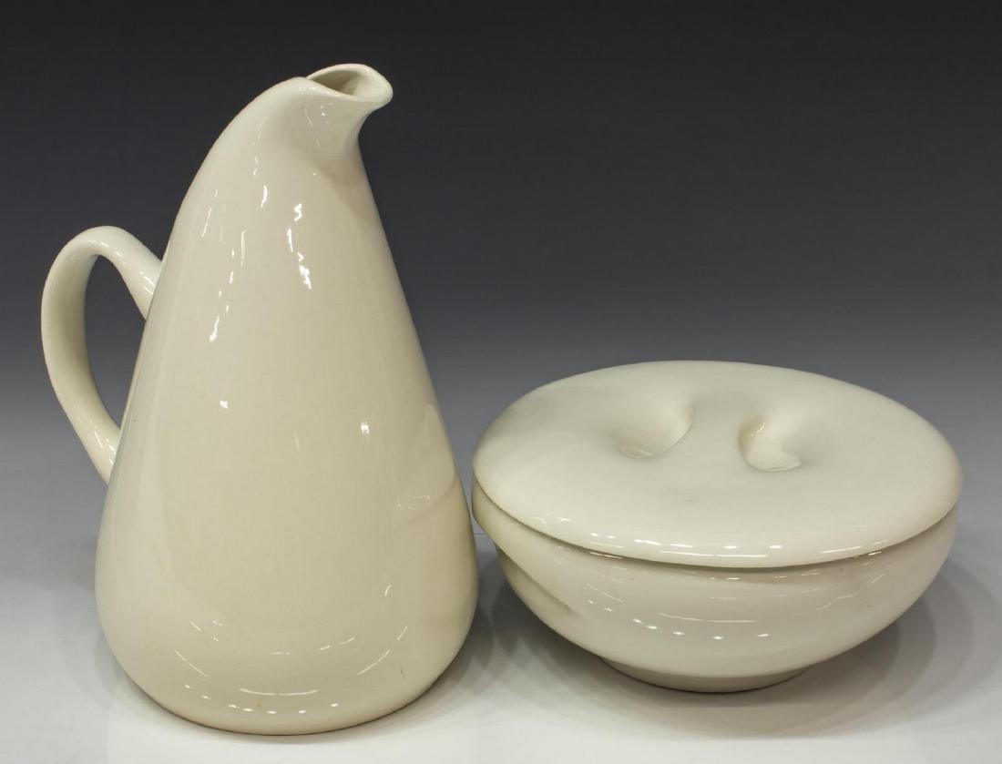 (2) RUSSEL WRIGHT MID-CENTURY WHITE TABLEWARE: (lot of 2) Mid-century modern white ceramic tableware, designed by Russel Wright (United States, 1904-1976), comprising (1) American Modern pitcher, Steubenville, approx 10"h, 6"w, 8"d, (1) Causal Whi
